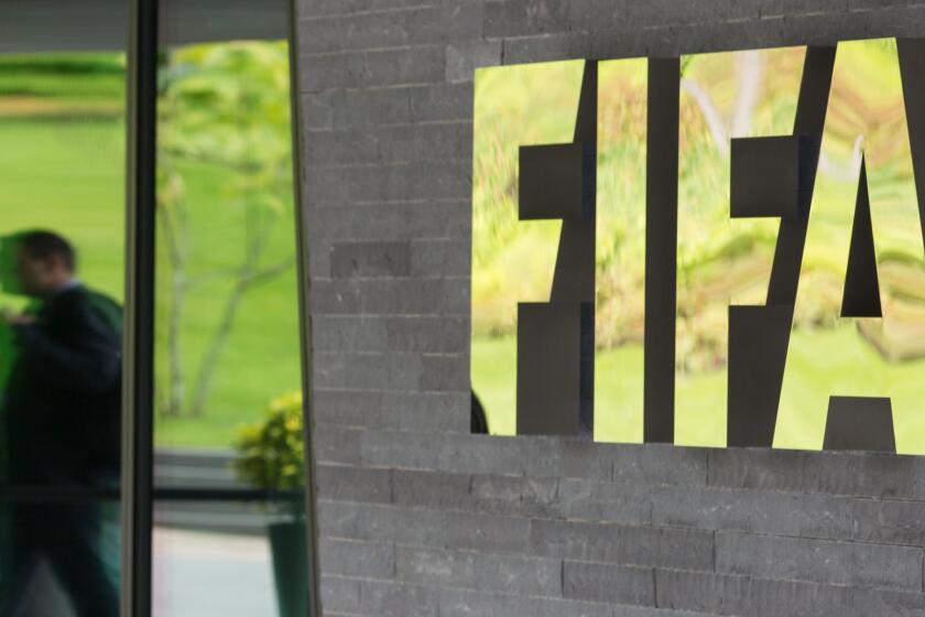 FIFA's logo appears at the entrance to the organization's headquarters in Zurich on May 27.