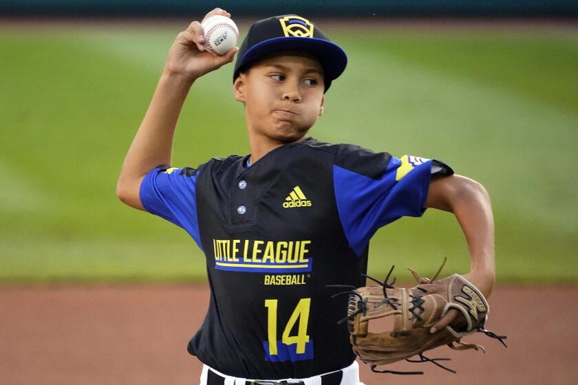 Torrance, Calif.'s Skylar Vinson delivers during the first inning of the team's baseball game against Hamilton, Ohio, at the Little League World Series in South Williamsport, Pa., Thursday, Aug. 26, 2021. (AP Photo/Gene J. Puskar)