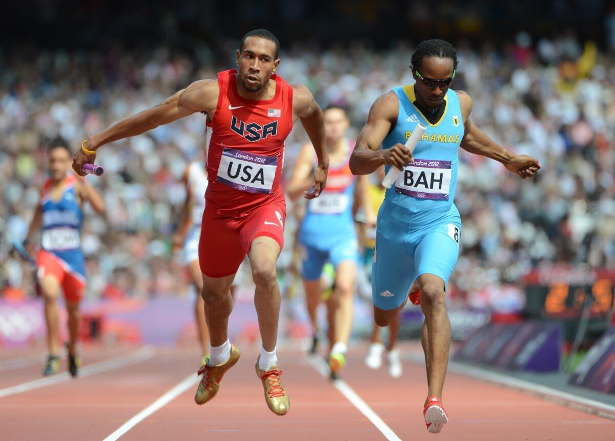 USC's Bryshon Nellum, shown competing in the 2012 Olympic Games at London next to the Bahamas' Chris Brown, won the NCAA 400-meter championship last weekend.