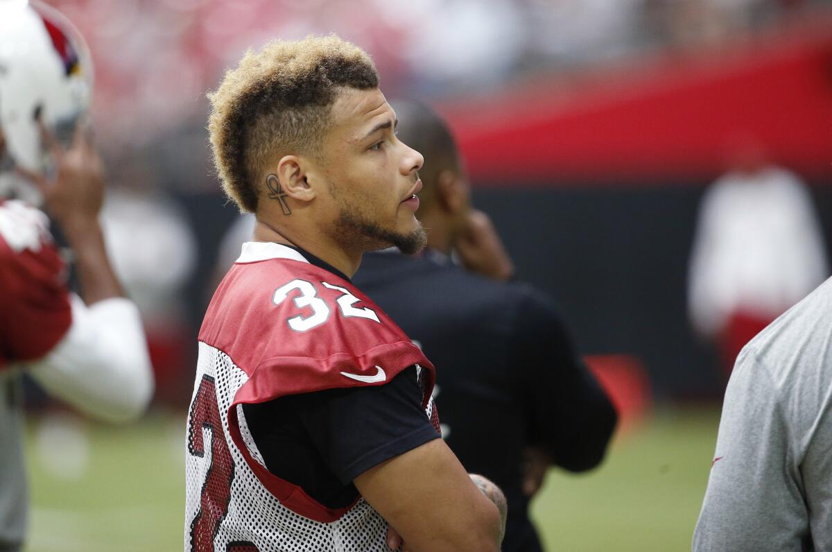 Injured Cardinals defensive back Tyrann Mathieu watches from the sidelines during practice at training camp on Aug. 9.