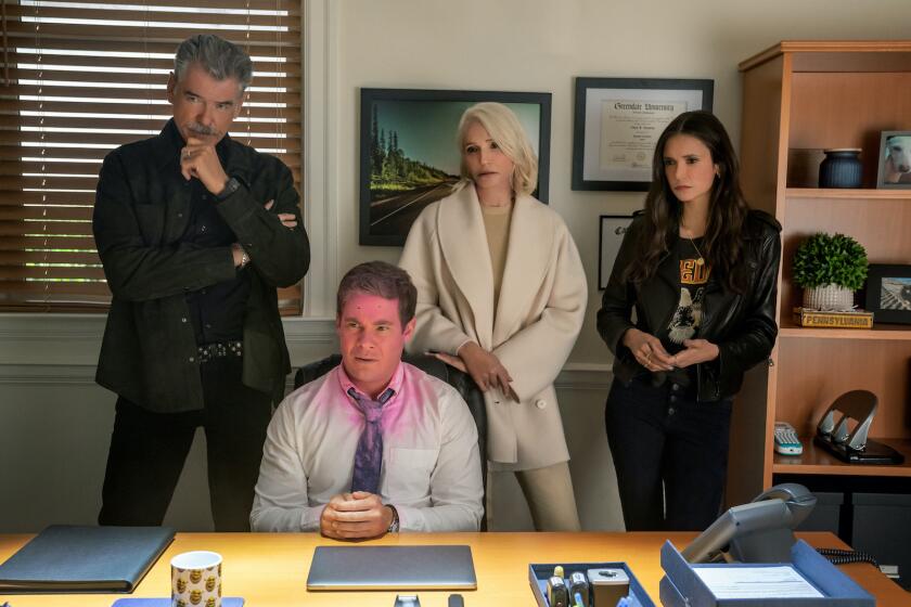Pierce Brosnan, from left, Adam Devine, Ellen Barkin and Nina Dobrev in the movie "The Out-Laws."