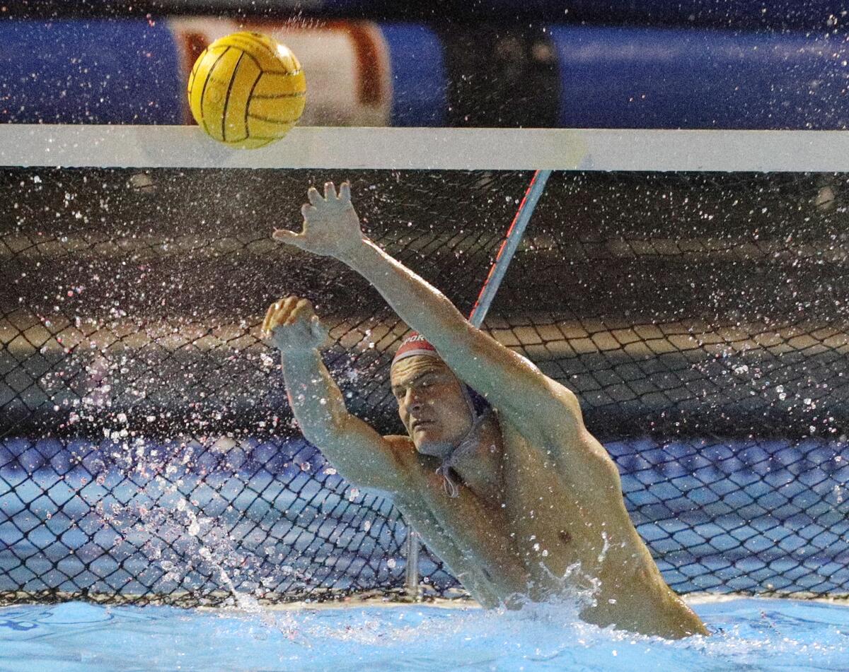 Newport Harbor goalkeeper Blake Jackson blocks a Loyola shot in the CIF Southern Section Division 1 semifinal playoff match at Woollett Aquatics Center in Irvine on Wednesday.