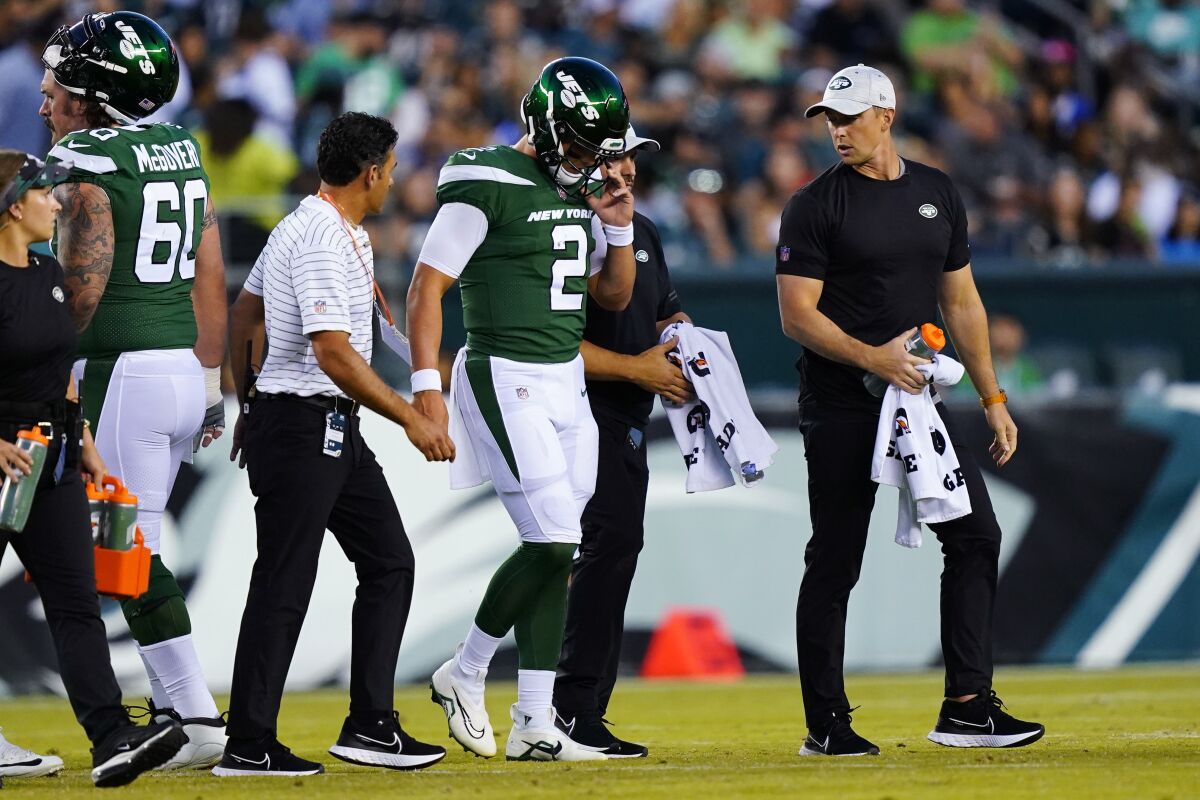 New York Jets' Zach Wilson is taken off the field after an injury during the first half of a preseason NFL football game against the Philadelphia Eagles on Friday, Aug. 12, 2022, in Philadelphia. (AP Photo/Matt Rourke)