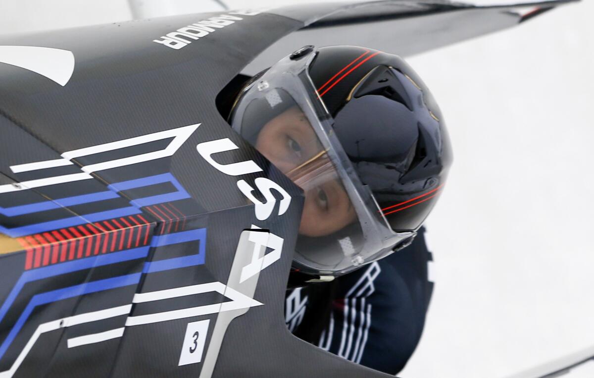Elana Meyers Taylor, shown at the women's bobsled World Cup on Dec. 13, is one of two women who will race with men at a World Cup event in Calgary, Canada, this weekend.