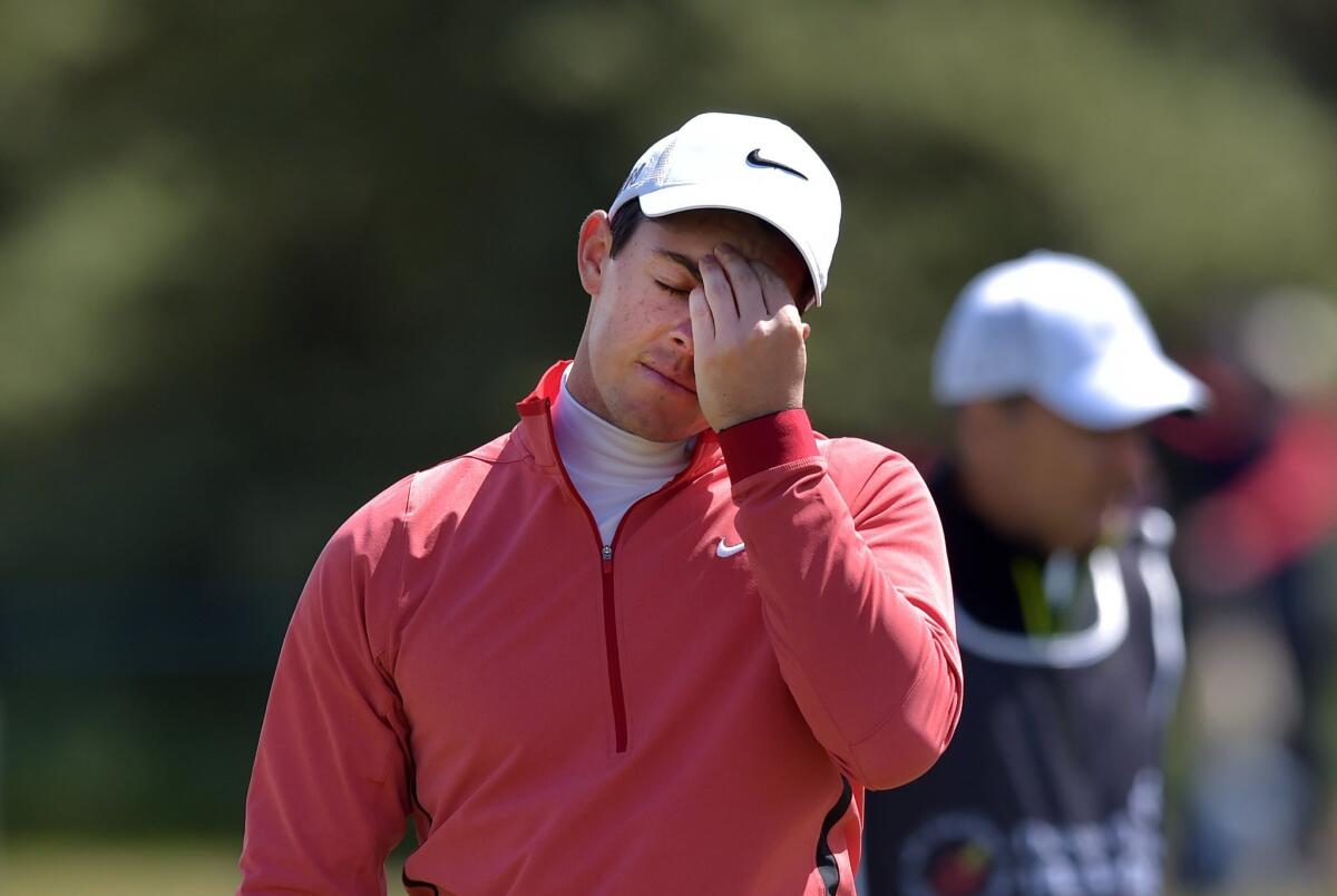 Rory McIlroy reacts after finishing the first round of the Irish Open at nine-over-par 80.