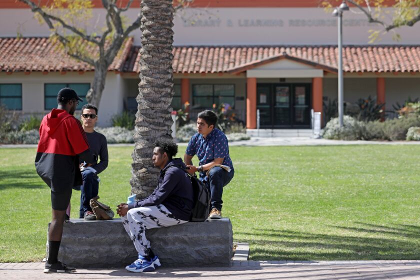 LONG BEACH, CA - MARCH 16: Students gather at Long Beach City College on Wednesday, March 16, 2022 in Long Beach, CA. Enrollment at California Community Colleges has plummeted nearly 20% during the pandemic to about 1.3 million students from fall 2019 to fall of 2021, according to state data. (Gary Coronado / Los Angeles Times)