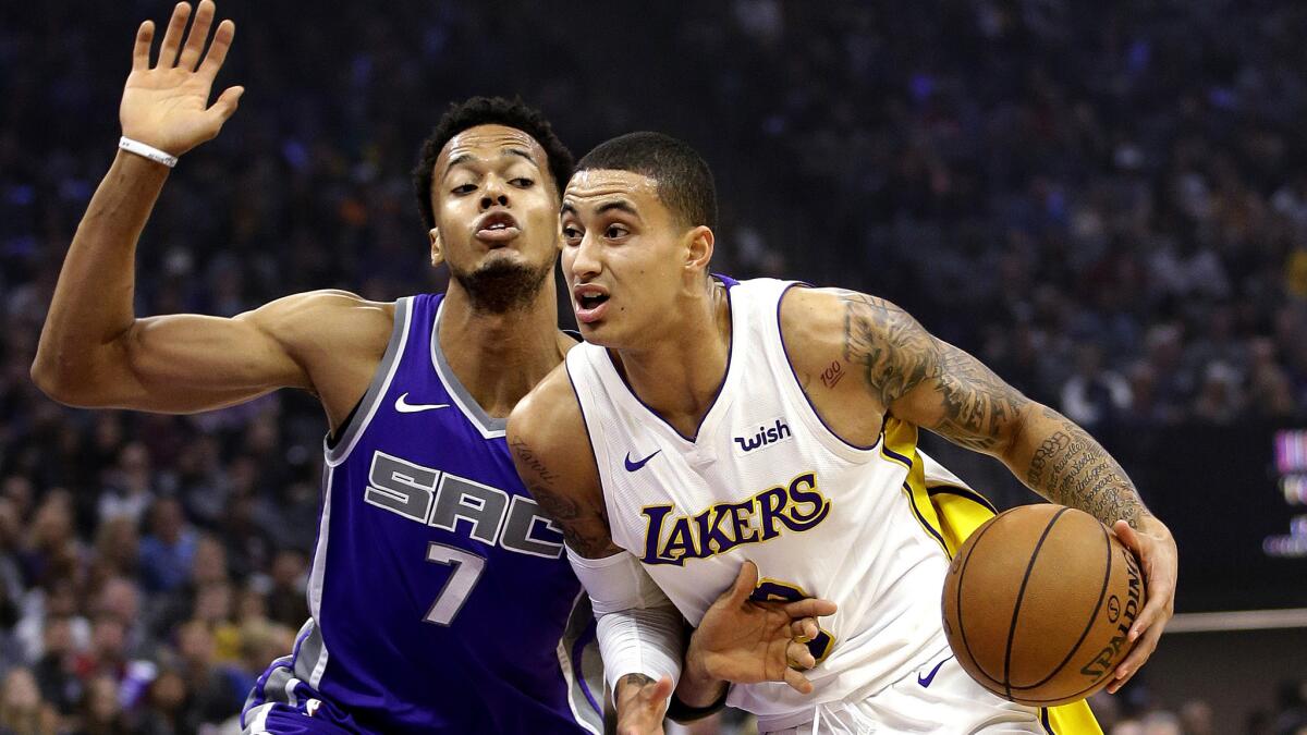 Lakers forward Kyle Kuzma drives against Kings forward Skal Labissiere during the first quarter Wednesday night.