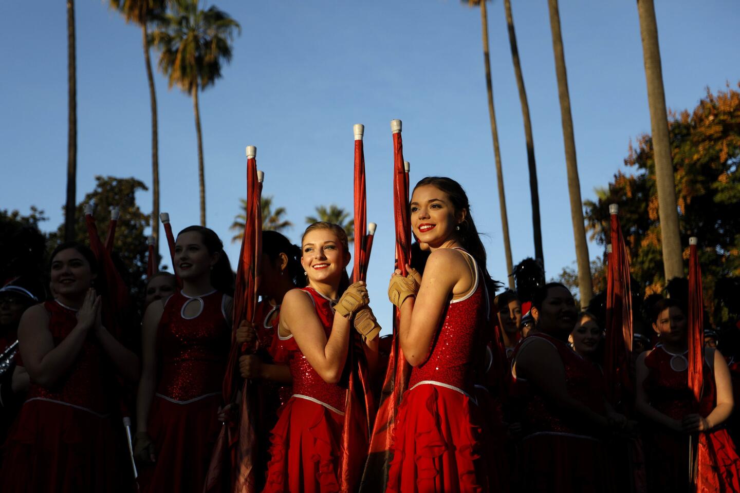 Abby Taylor, left, and Macey Glassco, of the Albertville High School "Aggie" Band, of Albertville, Al., await the start of the 129th Rose Parade.