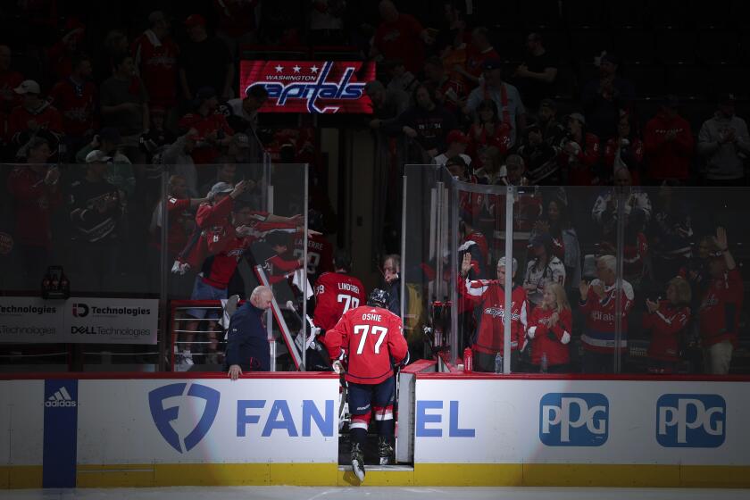 Washington Capitals right wing T.J. Oshie (77) exits the ice after being eliminated by the New York Rangers in Game 4 of an NHL hockey Stanley Cup first-round playoff series Sunday, April 28, 2024, in Washington. (AP Photo/Tom Brenner)