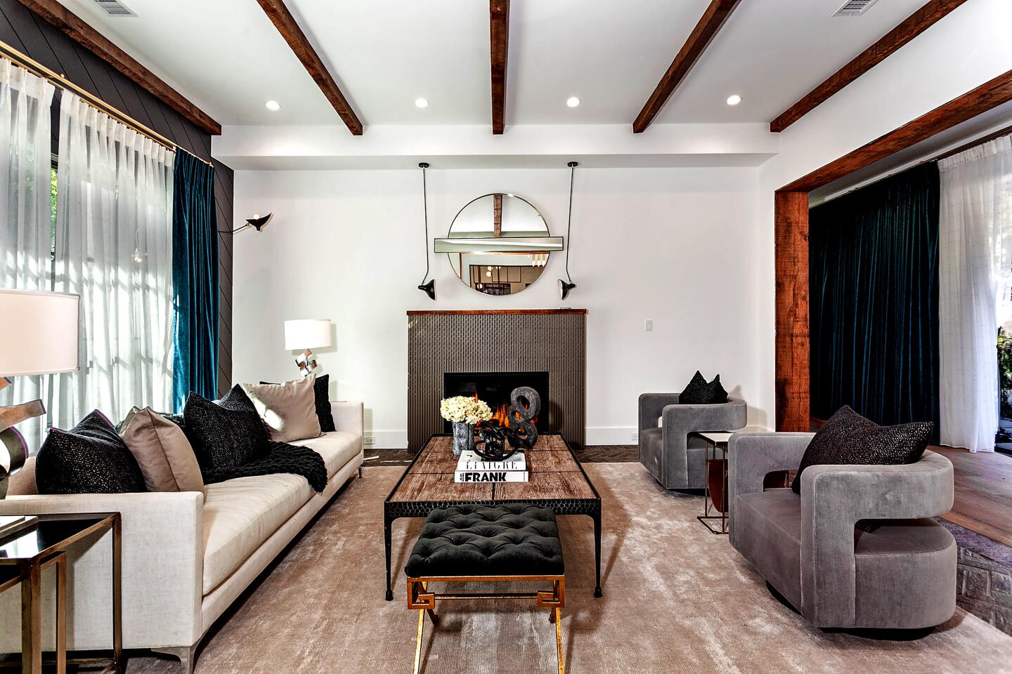 Rustic wood brings a farmhouse feel to Kelly Clarkson's home; the living spaces have clean lines and walls of glass.