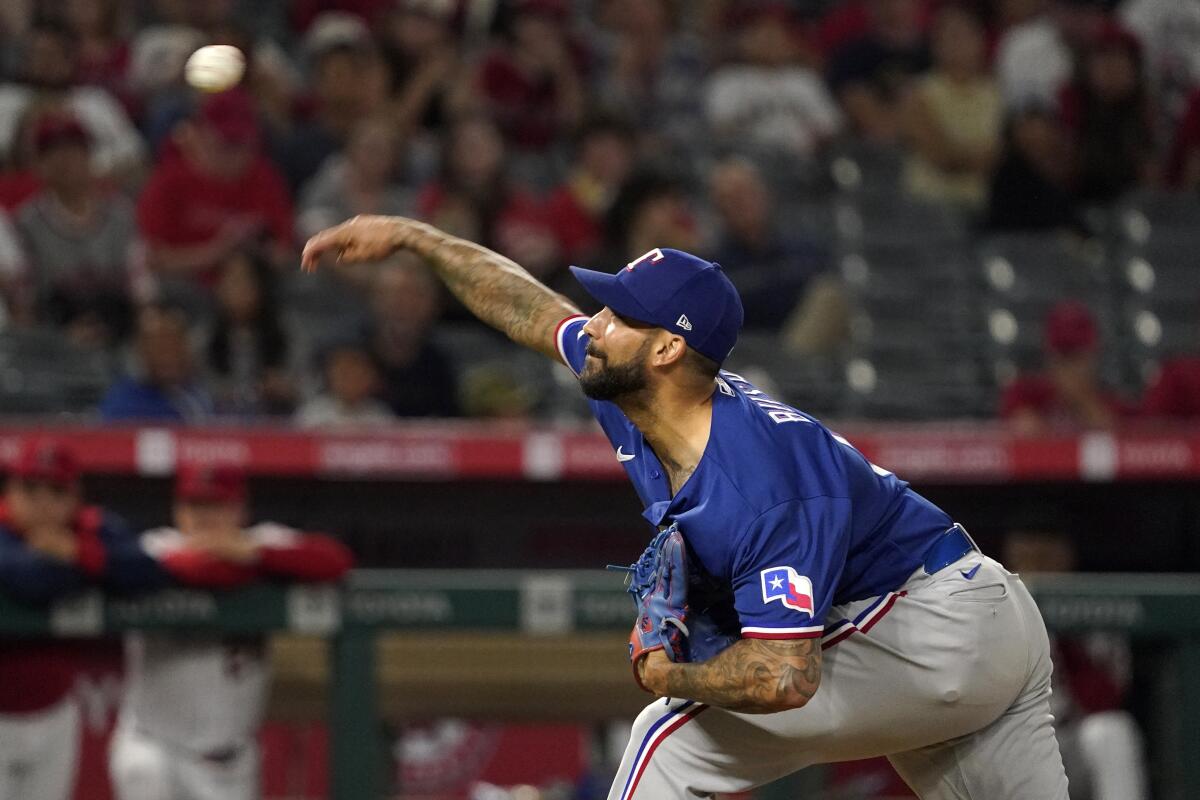 Texas Rangers relief pitcher Matt Bush throws to the plate during the ninth inning of a baseball game against the Los Angeles Angels Friday, July 29, 2022, in Anaheim, Calif. (AP Photo/Mark J. Terrill)