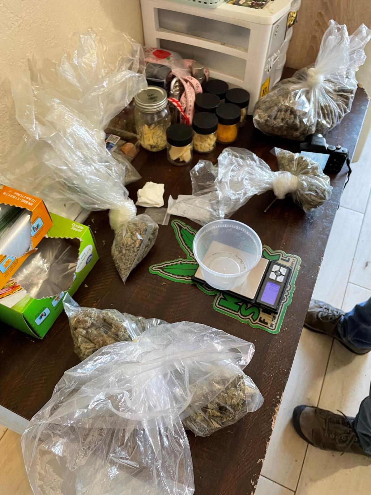 Cannabis, money and a gun and ammunition were seized from a City Heights home Tuesday.