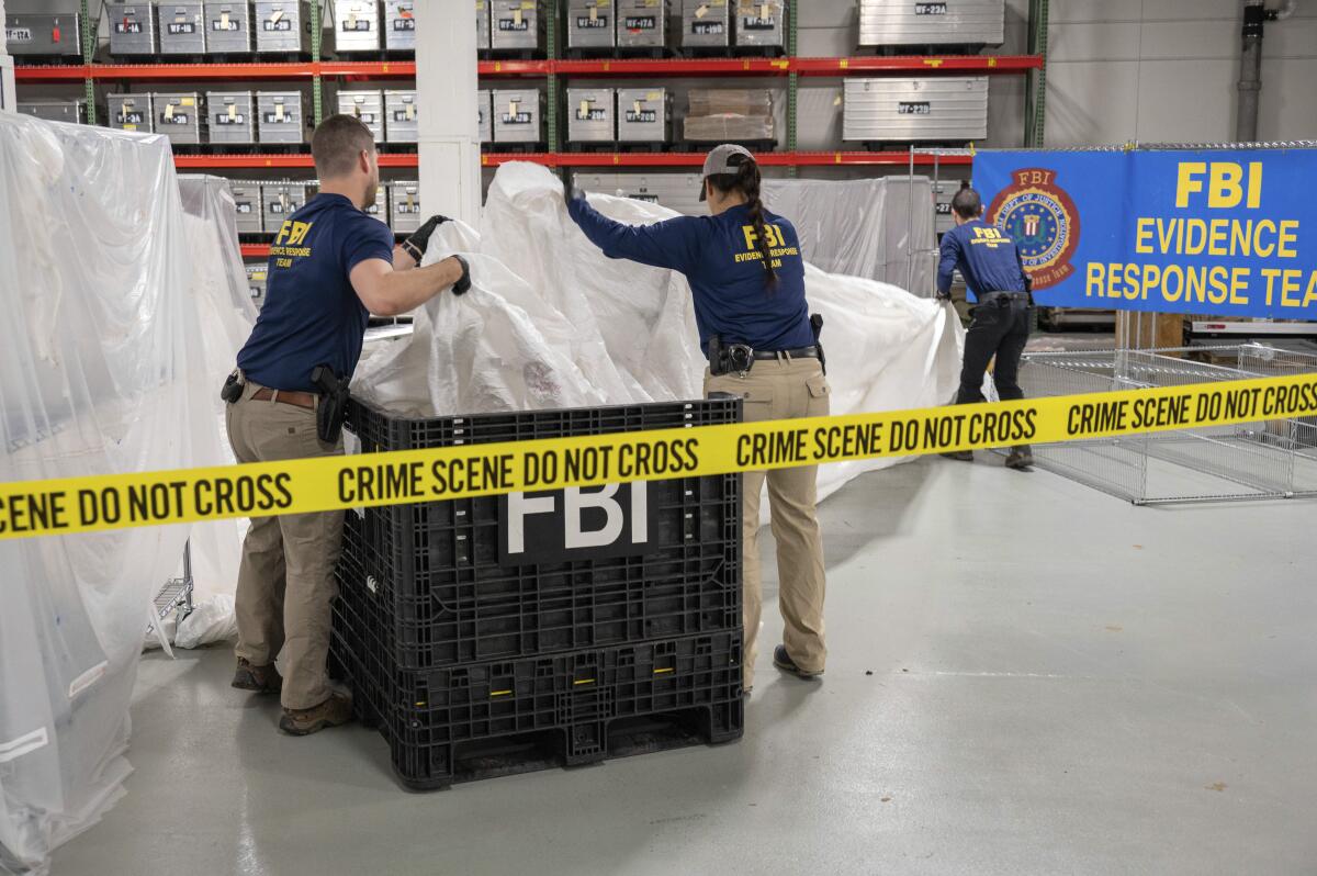 FBI special agents process material recovered from the high altitude balloon recovered off the coast of South Carolina.