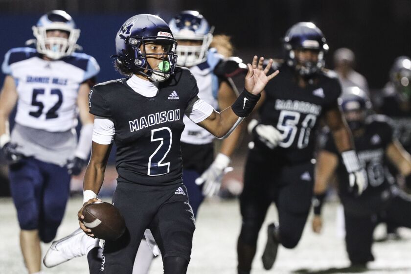 San Diego, CA - September 23: Madison's Reggie Johnson (2) looks to pass against Granite Hills during their game at Madison High School on Friday, Sept. 23, 2022 in San Diego, CA. (Meg McLaughlin / The San Diego Union-Tribune)