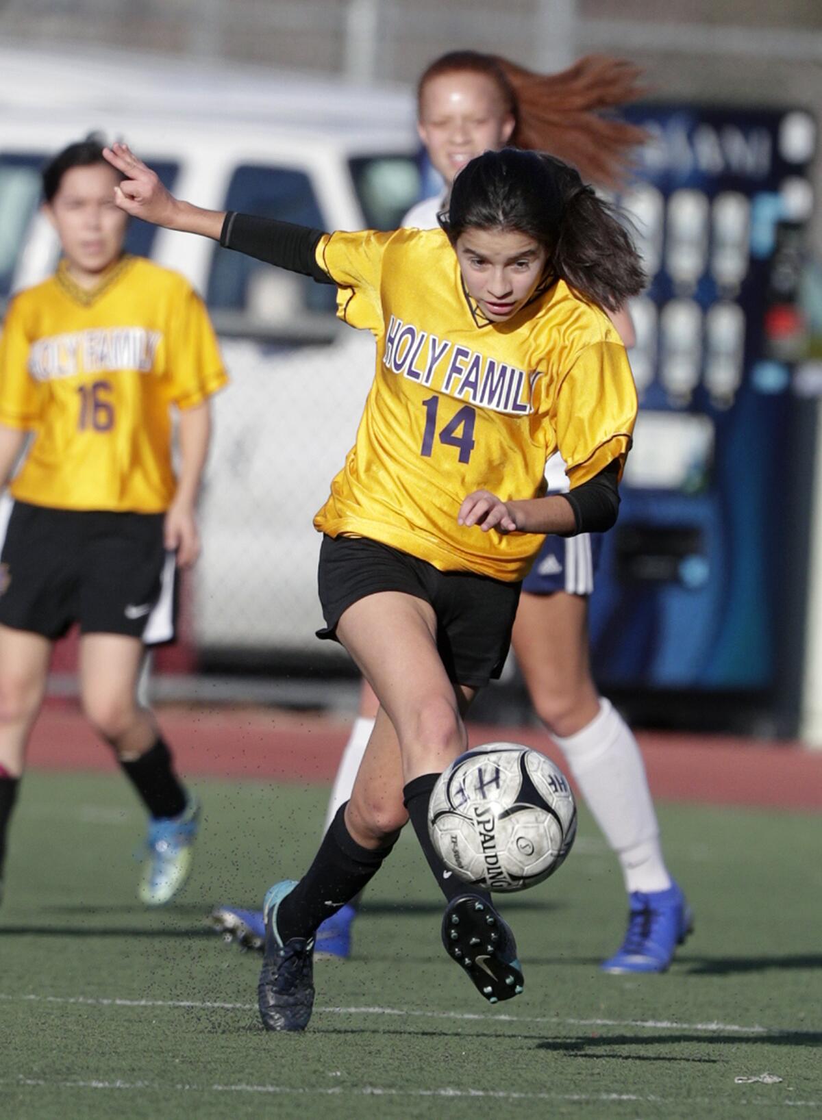 Holy Family's Maya Devora passes against Alverno Heights in a Horizon League girls' soccer game at the Glendale Sports Complex in Glendale on Monday, January 27, 2020.