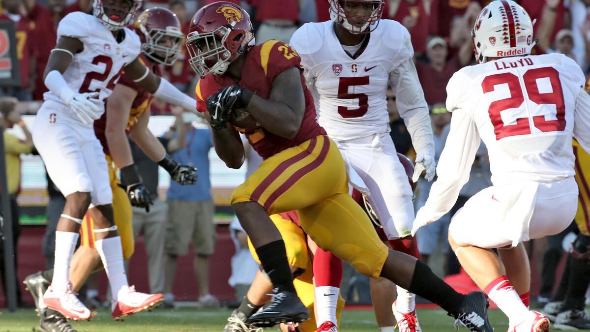 USC tailback Tre Madden beats the Stanford defense for a touchdown in the first quarter at the Coliseum on Sept. 19.
