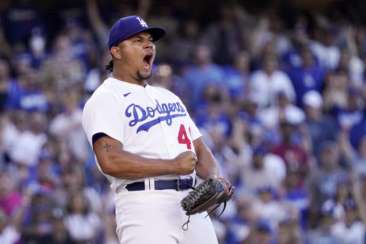Dodgers relief pitcher Brusdar Graterol celebrates after striking out San Diego's Manny Machado during a game in July.