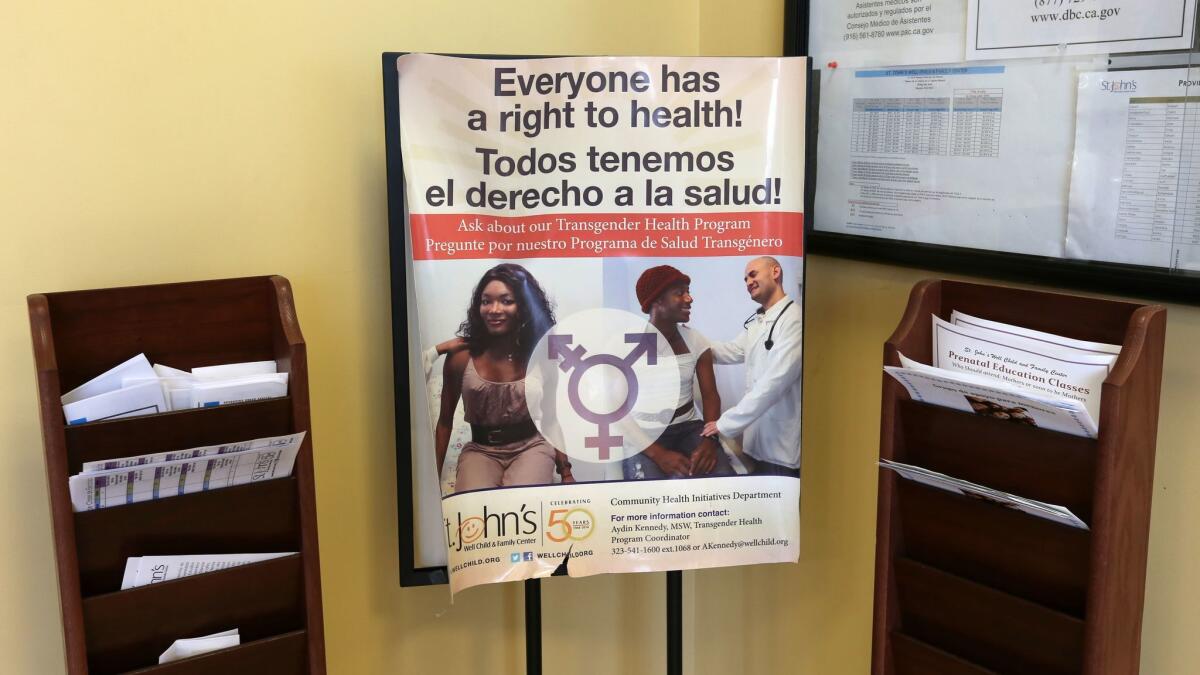A poster advertises a transgender health program at St. John's in South L.A. The clinic provides culturally appropriate services to the local transgender community, whose members often can't afford the expensive medical care they require. (Irfan Khan / Los Angeles Times)