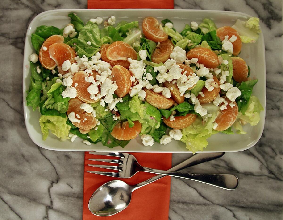 Salad of tangerines, butter lettuce and goat cheese.