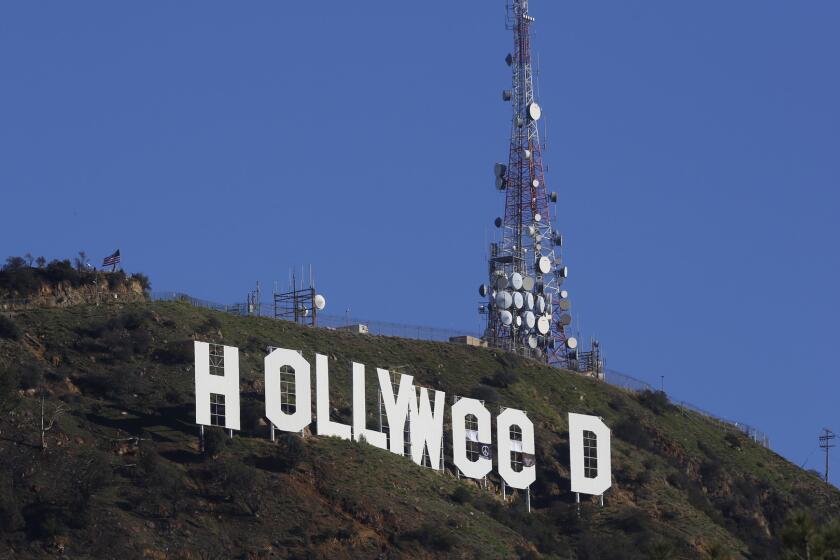 Los Angeles residents woke New Year's Day to find a prankster had altered the Hollywood sign to read "HOLLYWeeD."