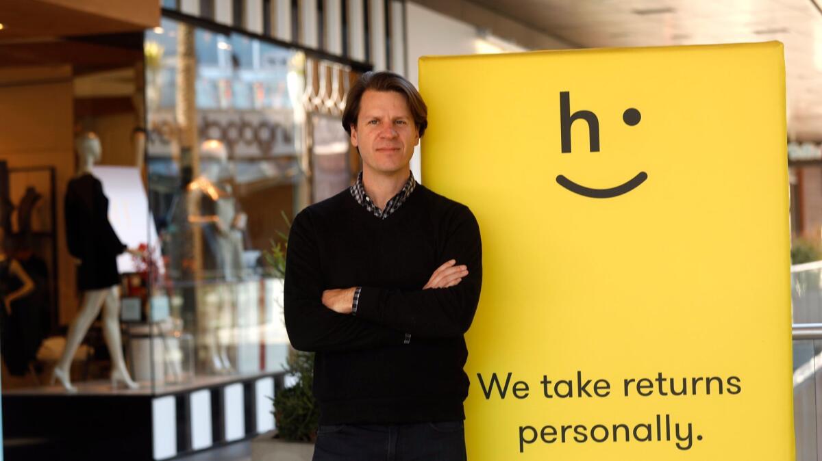 David Sobie, a co-founder of Happy Returns, stands at a "return bar" for customers who wish to return online purchases at Santa Monica Place.