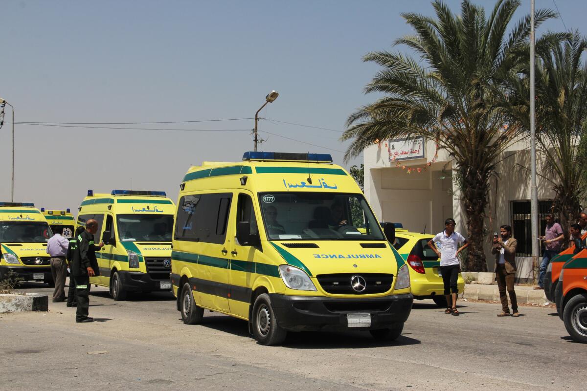 Ambulances from the Egyptian Ministry of Health cross into the Gaza Strip at the Rafah border crossing on Thursday.