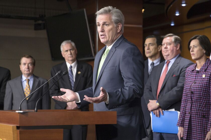 Surrounded by California Republicans, House Majority Leader Kevin McCarthy of Calif., center, answers questions from reporters about attempts to include language addressing the state's drought in a $1.1-trillion government-wide spending bill.