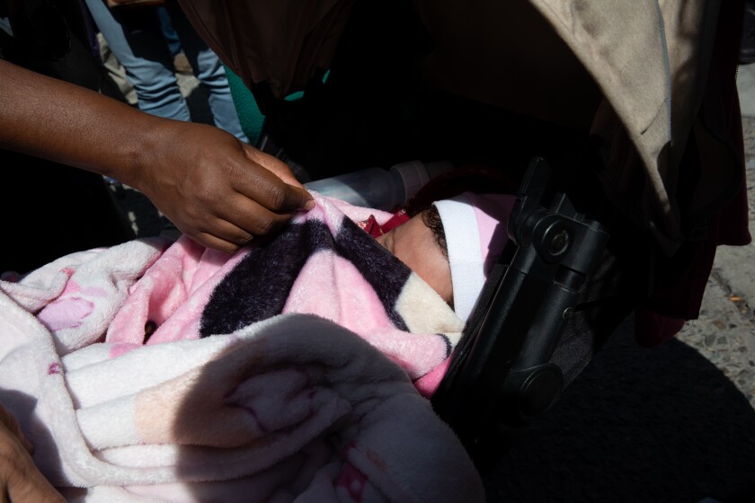 A 1-month-old baby and her parents walked to San Ysidro Pedestrian East Port of Entry in protest of Title 42