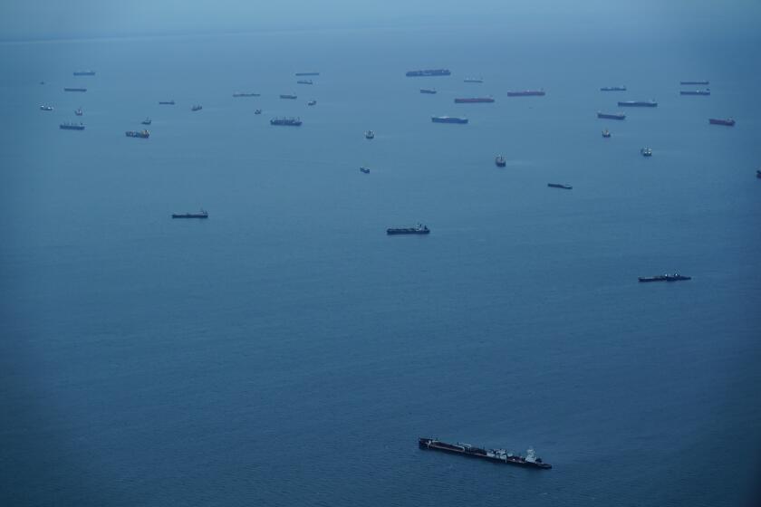 FILE - Cargo ships wait in Panama Bay before moving through the Panama Canal in Panama City, Sept. 23, 2023. The climate phenomenon known as El Niño — and not climate change — was a key factor driving low rainfall that disrupted shipping at the Panama Canal, scientists said Wednesday, May 1, 2024. (AP Photo/Arnulfo Franco, File)