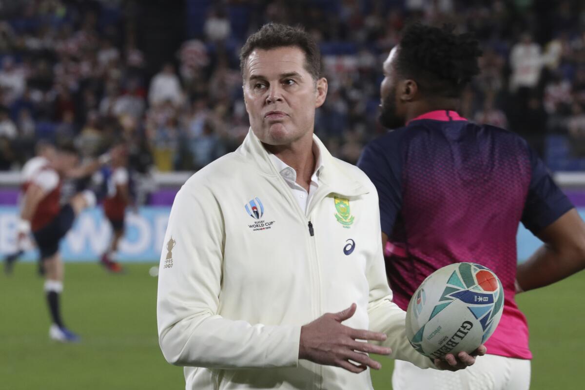 FILE - South Africa's coach Rassie Erasmus looks on ahead of their Rugby World Cup final against England at International Yokohama Stadium in Yokohama, Japan on Nov. 2, 2019. Rugby is trialing new laws banning certain officials from acting as on-field water carriers in a move viewed as a direct response to the contentious tactics of South Africa director of rugby Rassie Erasmus. (AP Photo/Eugene Hoshiko, File)