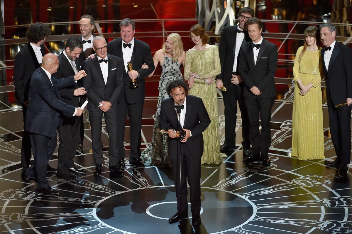 "Birdman" director Alejandro G. Iñárritu accepts the Oscar for best picture.