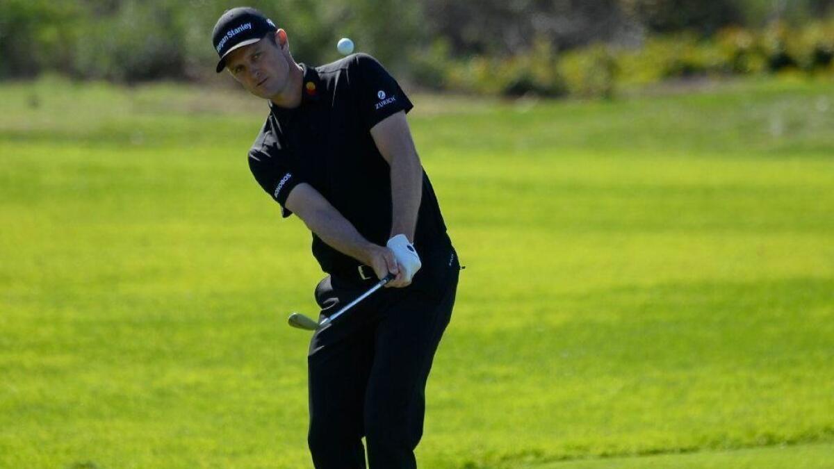 Justin Rose hits a chip shot during the second round of the Farmers Insurance Open at Torrey Pines on Friday.