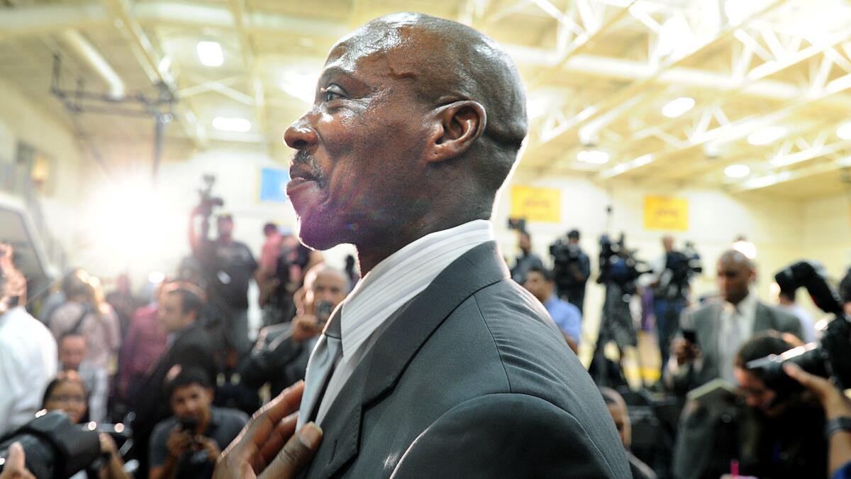Byron Scott is introduced as the coach of the Lakers during a news conference at the team's training facility in El Segundo on July 24.