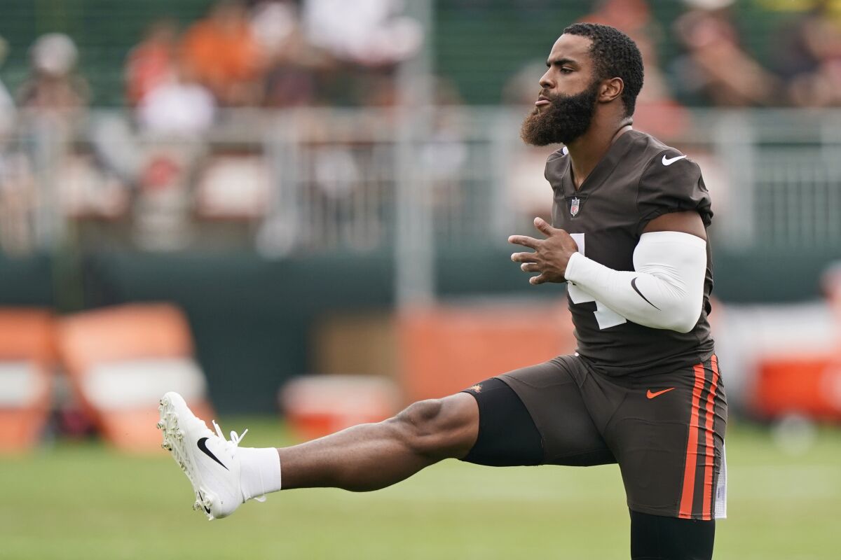 Cleveland Browns middle linebacker Anthony Walker warms up during practice at the NFL football team's training camp facility, Tuesday, Aug. 17, 2021, in Berea, Ohio. (AP Photo/Tony Dejak)