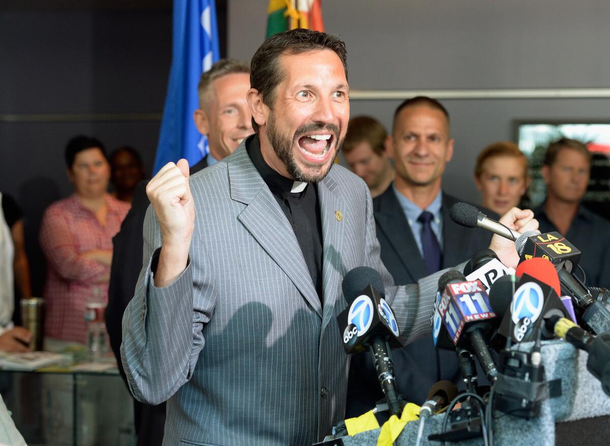 Reverend Neil Thomas of California Faith for Equality celebrates during a news conference at the West Hollywood City Hall after the U.S. Supreme Court struck down a key part of the Defense of Marriage Act, and ruled that supporters of California's ban on gay marriage, Proposition 8, lacked legal standing to challenge a federal judge's holding that the initiative was unconstitutional.