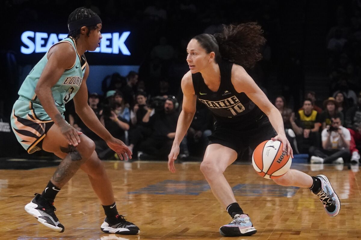 Seattle Storm guard Sue Bird (10) drives against New York Liberty guard CrystalDangerfield during the first half of WNBA basketball game Sunday, June 19, 2022 at Madison Square Garden in New York. (AP Photo/Mary Altaffer)
