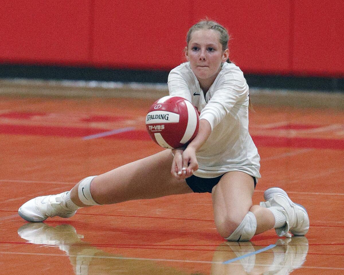Burroughs' Carlotte Hobson drops to hit a Murrieta Valley kill into play in a CIF Division II playoff girls' volleyball match at Burroughs High School on Thursday, October 24, 2019. Murrieta Valley won the match 3-0.