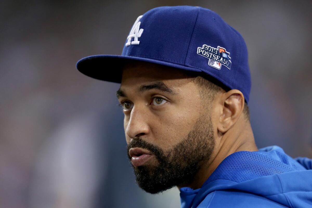 Matt Kemp looks on while the Dodgers take on the St. Louis Cardinals in Game 3 of the National League Championship Series at Dodger Stadium.