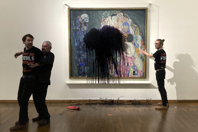 Austrian activists of "last generation Austria" have splashed a Gustav Klimt painting with oil in the Leopold museum in Vienna, Austria, Tuesday, Nov.15, 2022. The painting is behind a glass cover and was unharmed. (AP Photo/Letzte Generation Oesterreich)