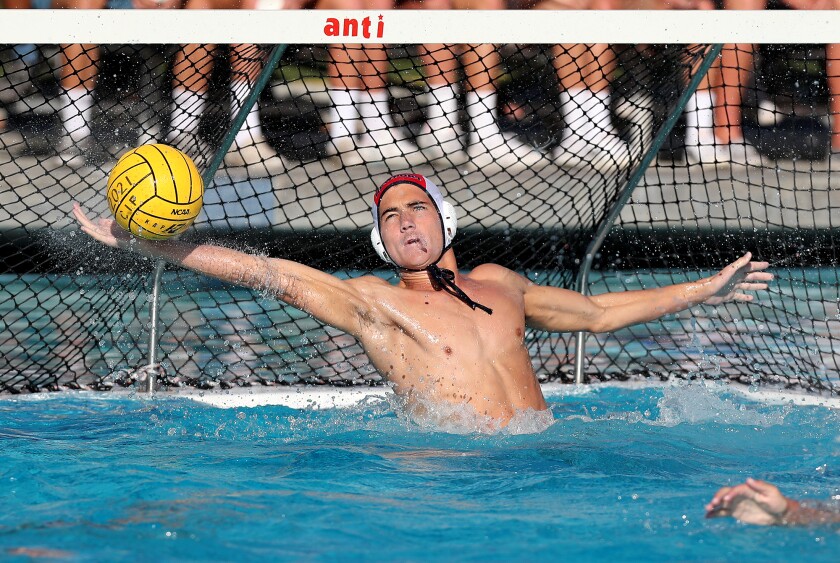 Newport Harbor goalkeeper Cooper Mathisrud is shown blocking a shot against Huntington Beach on Nov. 13.