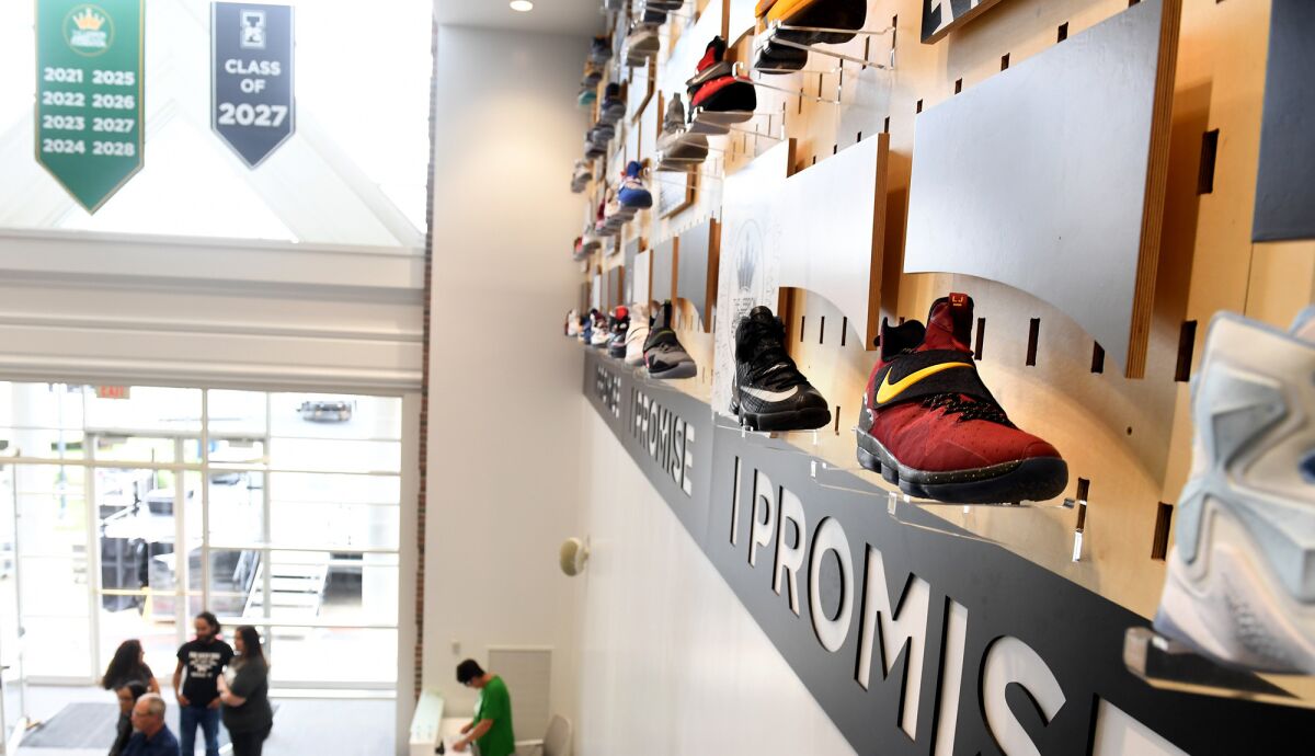 Walls at the I Promise School are lined with shoes worn by LeBron James during games. Donors names or an inspirational word goes on the plaque when a pair is purchased.
