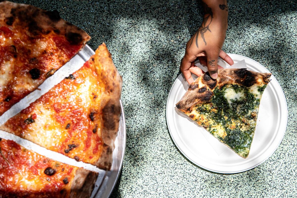 LOS ANGELES, CA - JUNE 15: The "New York-ish" green and red pizza from Pizzeria Bianco located at the ROW on Wednesday, June 15, 2022 in Los Angeles, CA. (Mariah Tauger / Los Angeles Times)