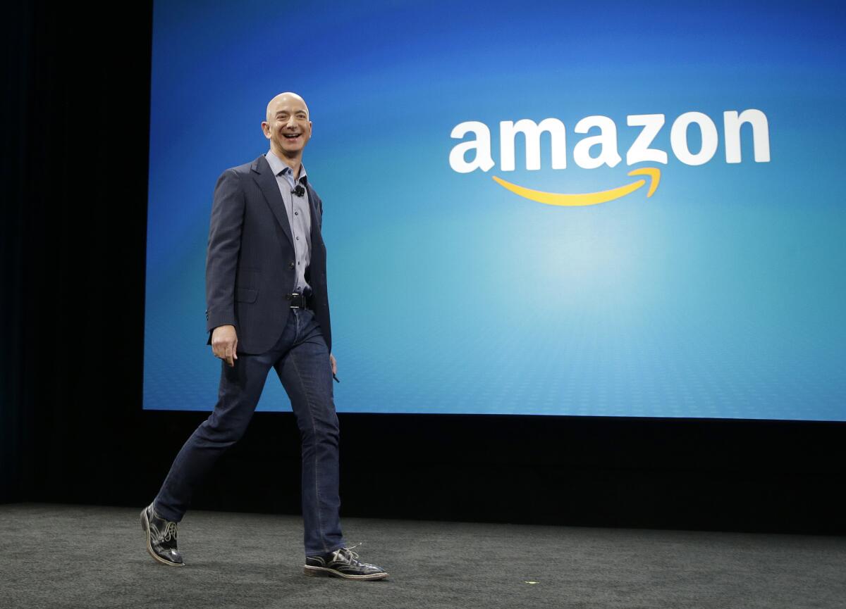 Amazon CEO Jeff Bezos walks on stage for the launch of the new Amazon Fire Phone.