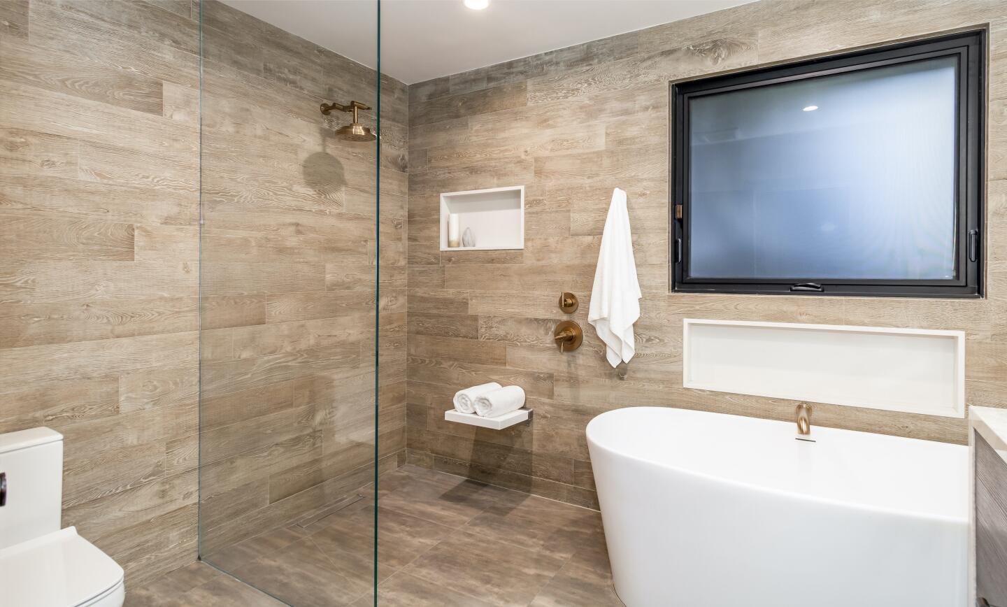 The primary bathroom with a freestanding tub.