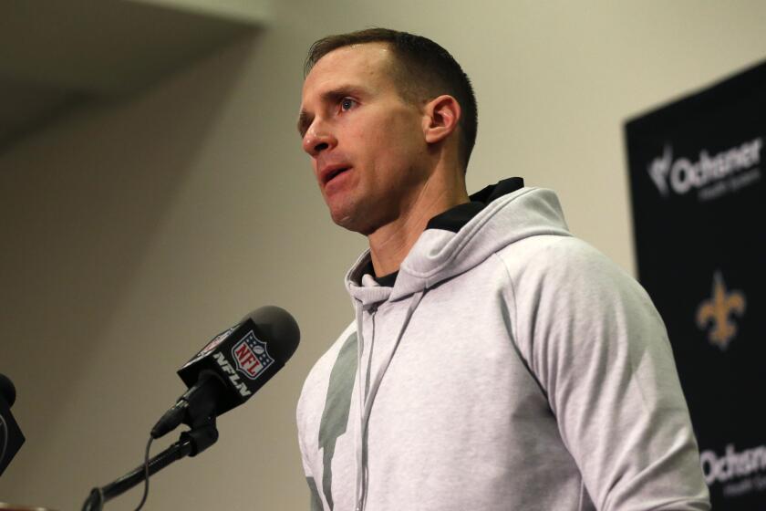 New Orleans Saints quarterback Drew Brees speaks during a news conference.