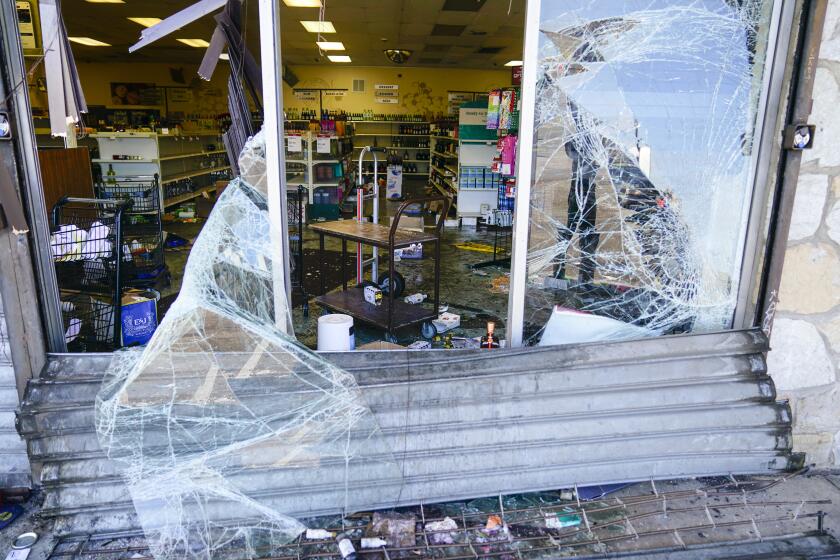 Shown is the aftermath of ransacked liquor store in Philadelphia, Wednesday, Sept. 27, 2023. Police say groups of teenagers swarmed into stores across Philadelphia in an apparently coordinated effort, stuffed bags with merchandise and fled. (AP Photo/Matt Rourke)
