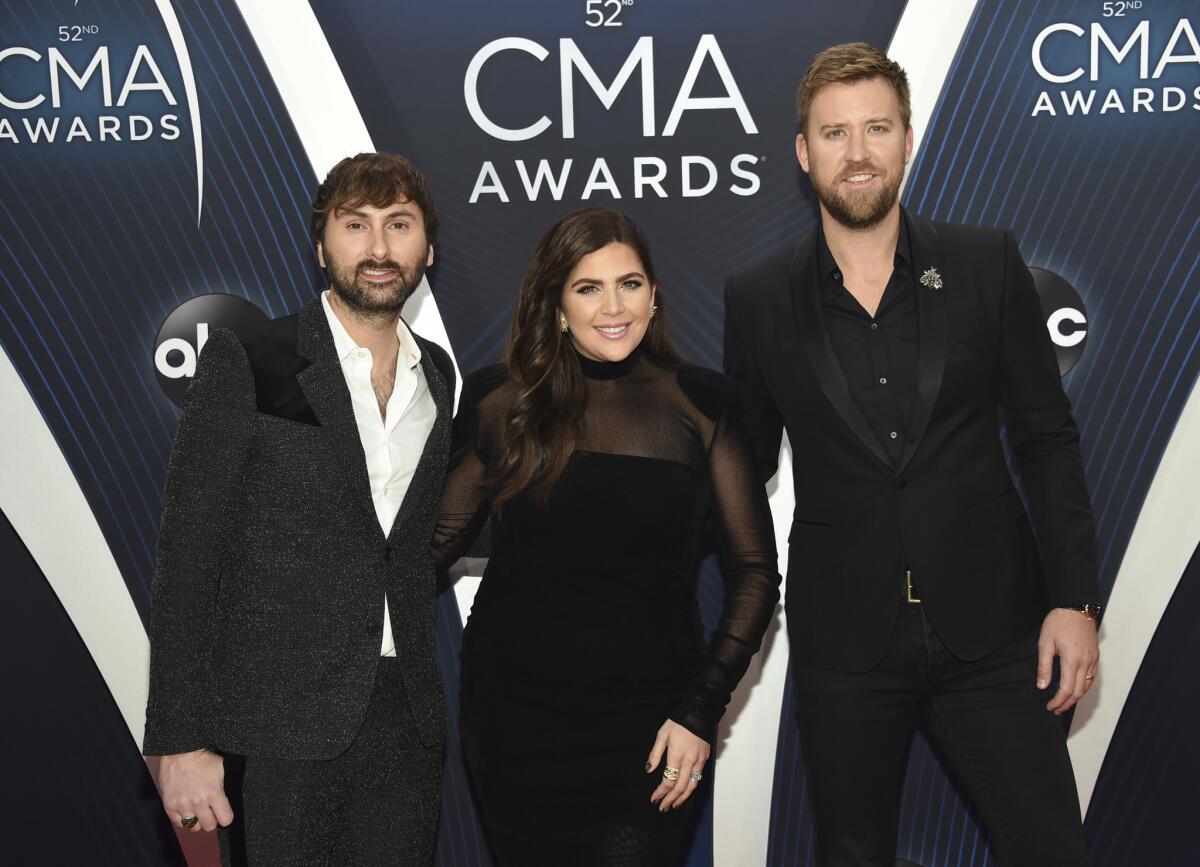 Dave Haywood, left, Hillary Scott and Charles Kelley recently changed their band's name from Lady Antebellum to Lady A.