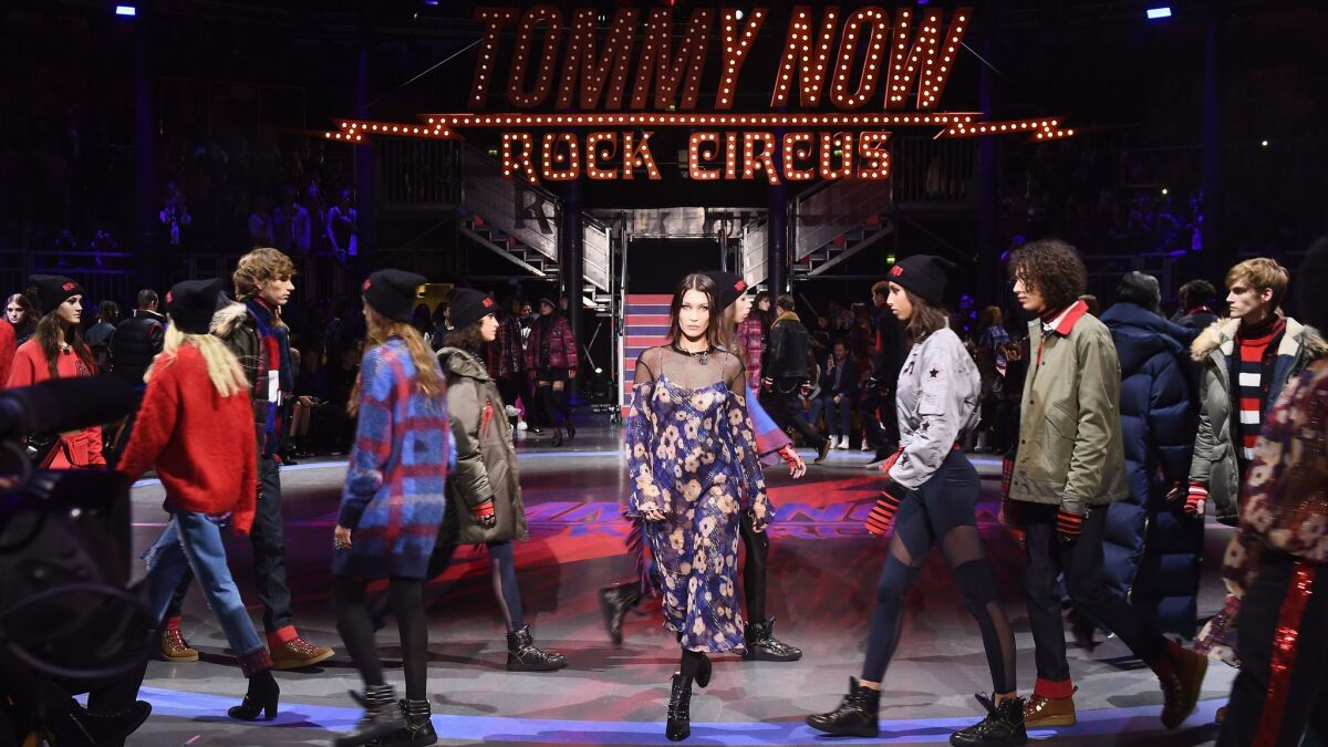 Bella Hadid, center, and other models walk the runway at Tommy Hilfiger and Gigi Hadid's TommyNow fall and winter 2017 show during London Fashion Week at the Roundhouse in London on Sept. 19.