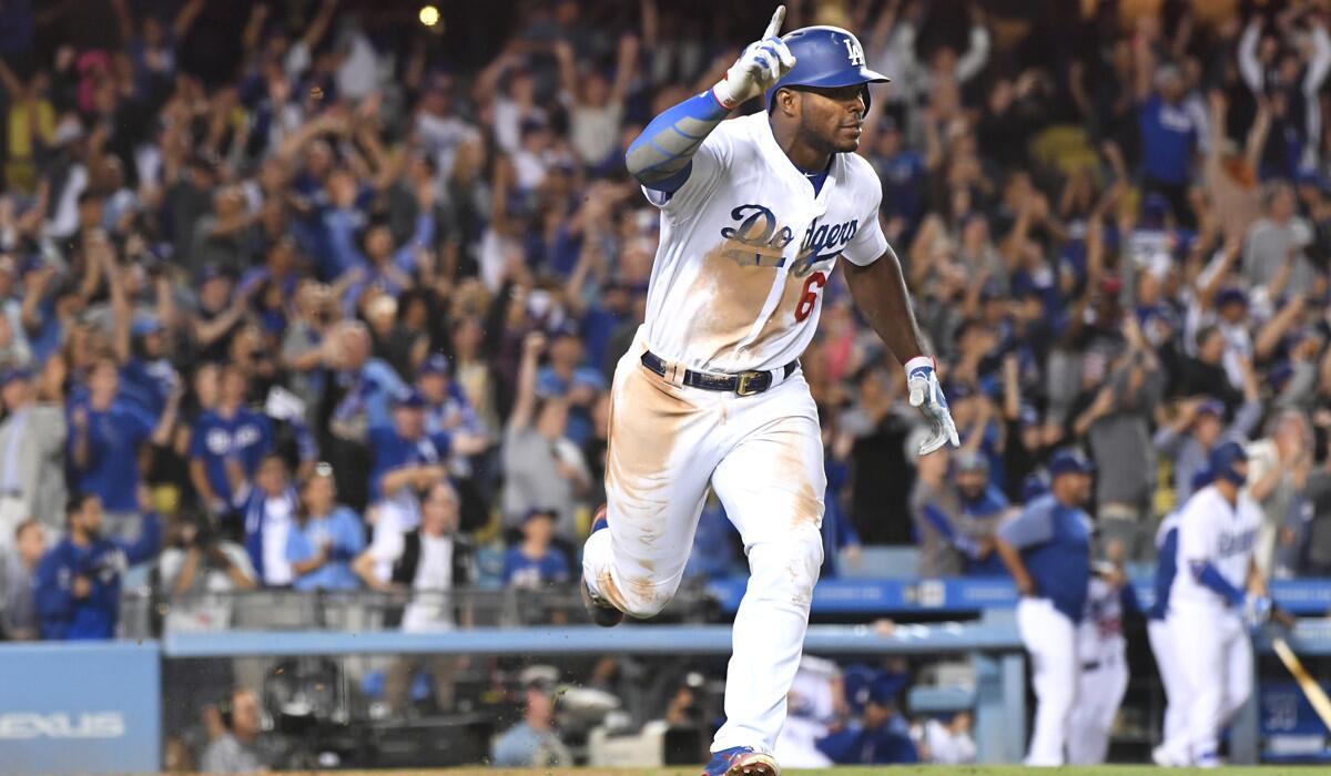 Yasiel Puig celebrates a game-winning hit against the White Sox.