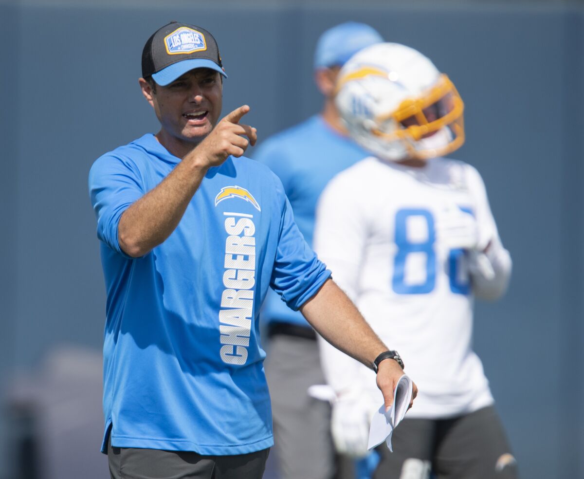 Chargers coach Brandon Staley instructs players during a minicamp practice in June.